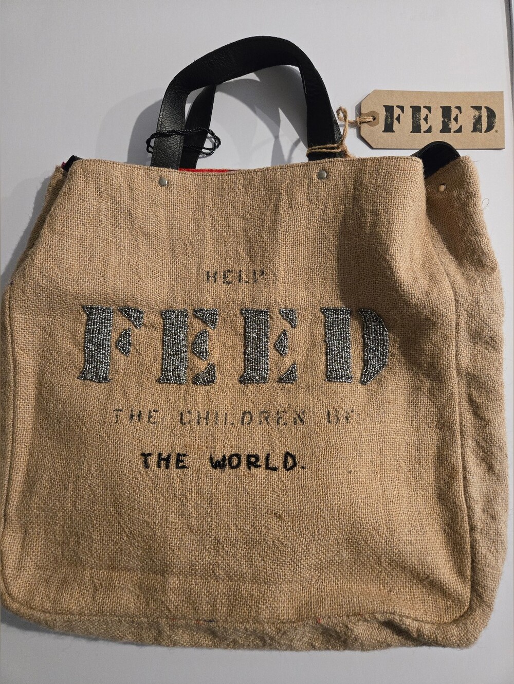 FEED Natural Jute Tote Bag with Black Handles